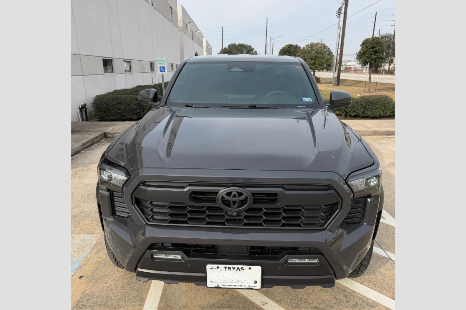 2024-2026 Tacoma Hood Conversion (Before) Front View