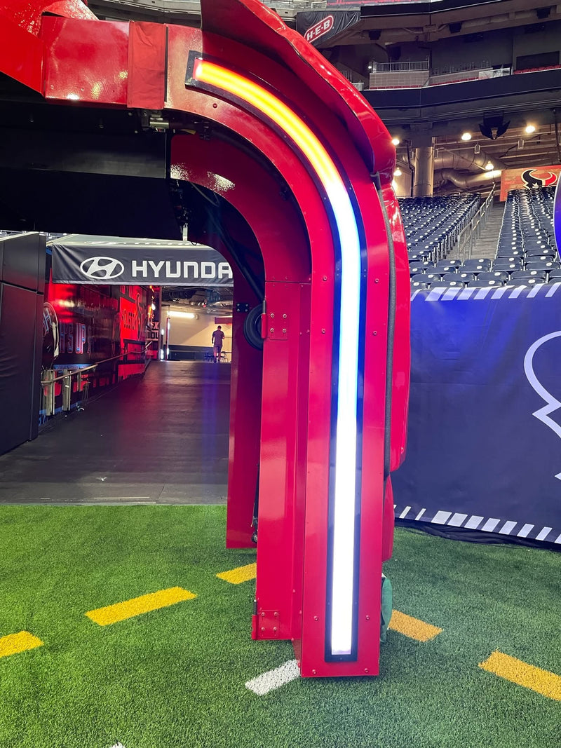 Close-up of a red armored arch on the Houston Texans bull entrance, painted by ReveMoto