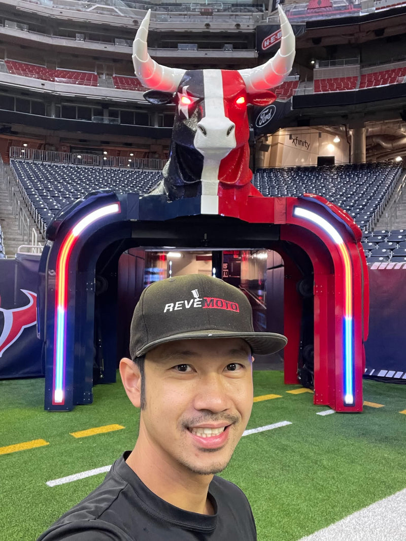 The finished Houston Texans bull entrance at NRG Stadium with its red and blue armored arches lit up