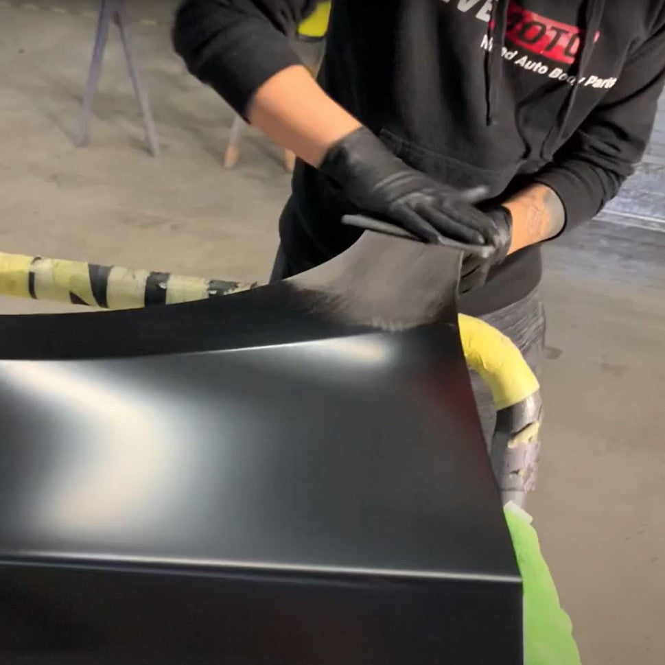 ReveMoto's Prepping Process - An Experienced Team Member Scuffing a Brand New Auto Body Part
