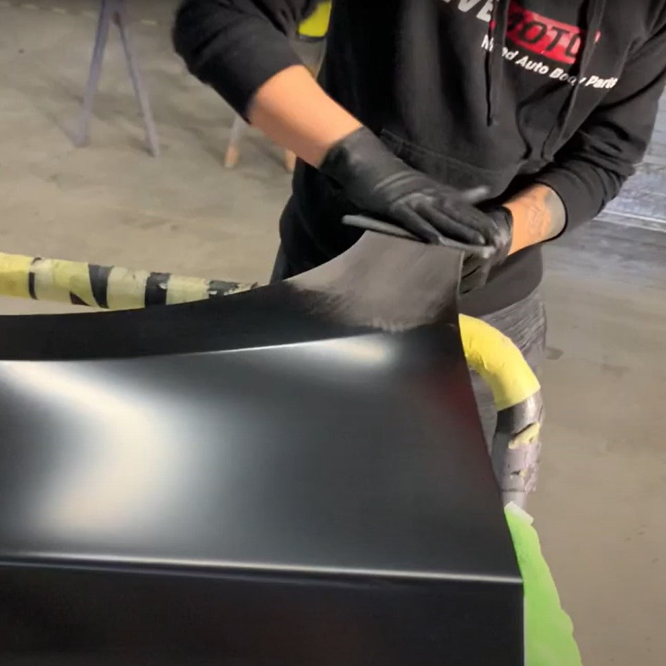 ReveMoto's Prepping Process - An Experienced Team Member Scuffing a Brand New Auto Body Part