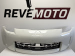 25627 - 2006-2009 Nissan 350Z Front Bumper Painted (w/o Nismo) Glacier Pearl (QX1) FBM22CF40H NI1000234