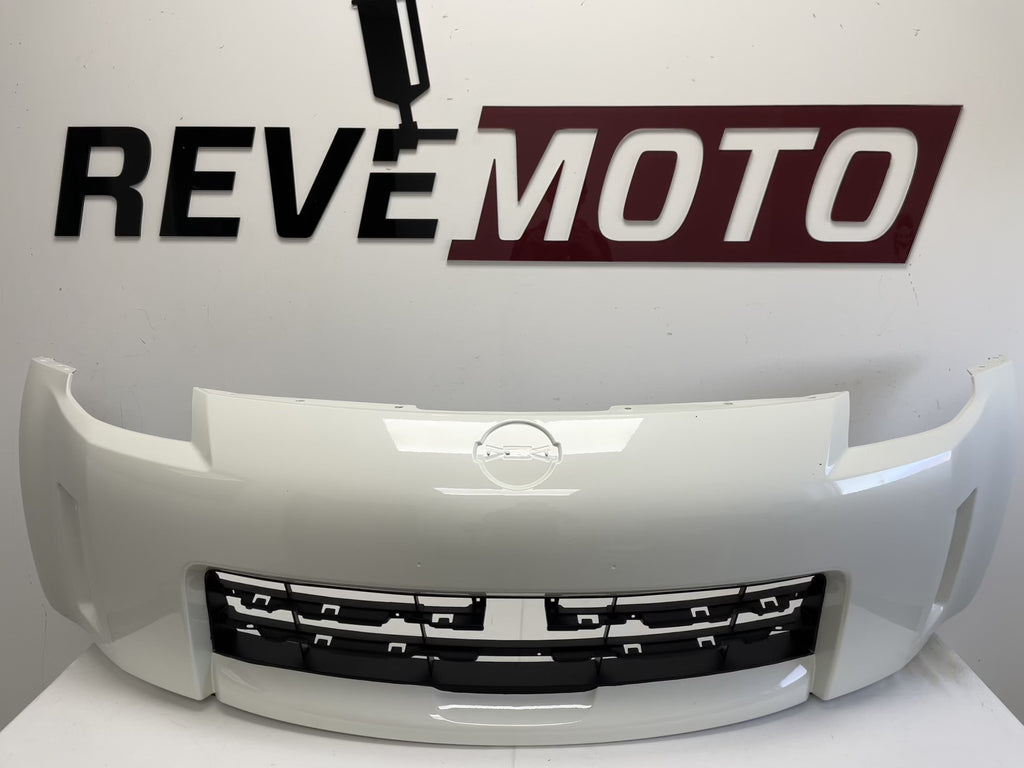 25627 - 2006-2009 Nissan 350Z Front Bumper Painted (w/o Nismo) Glacier Pearl (QX1) FBM22CF40H NI1000234